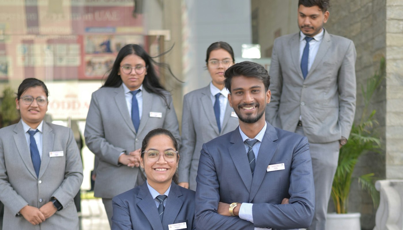 Hospitality team in uniform outside their workplace
